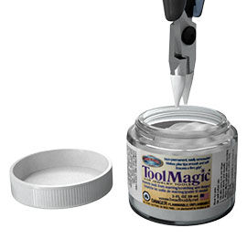 Pliers over a jar of tool magic